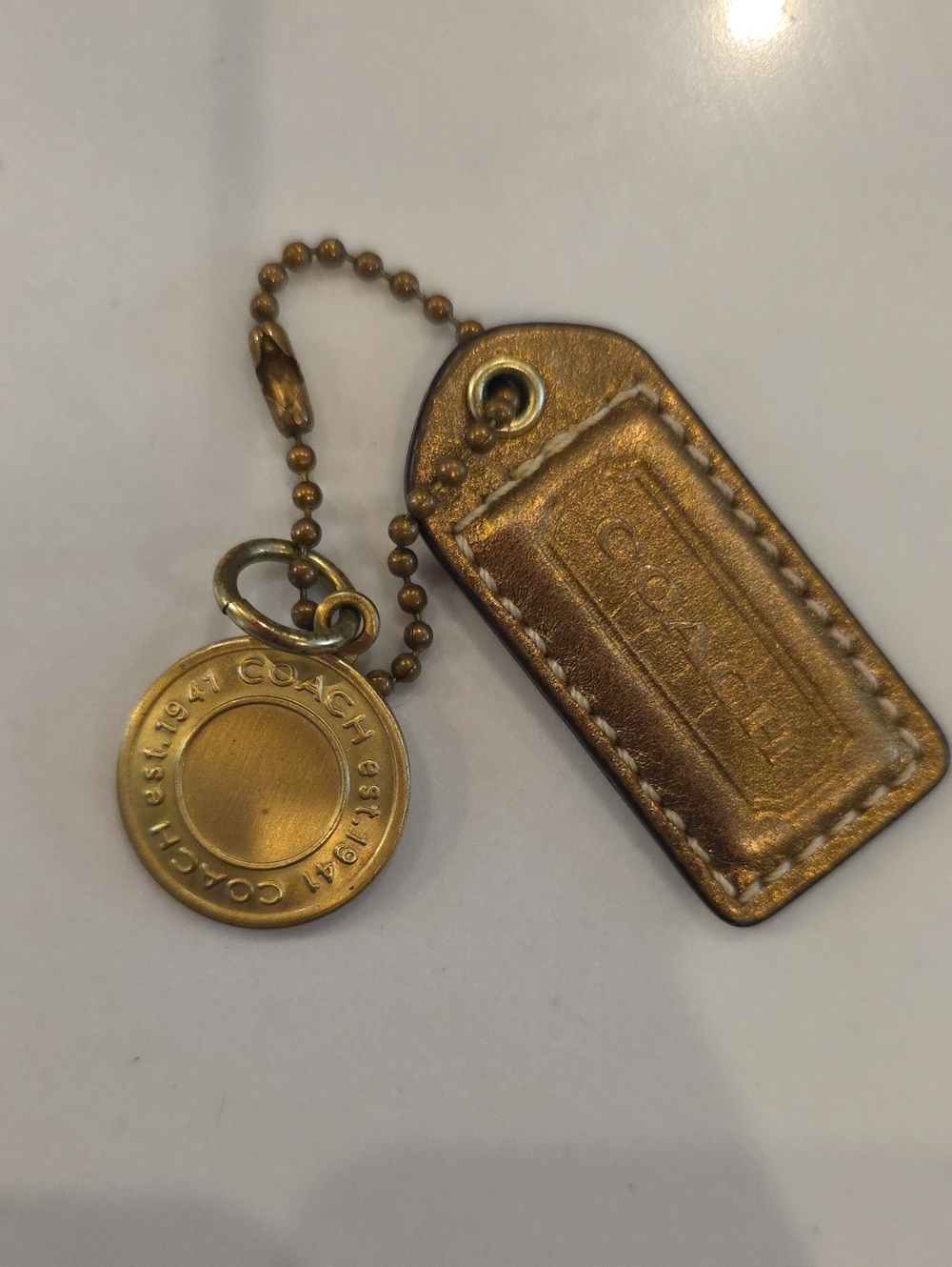 Coach Snaphead Medallion And Bronze Metallic Hangtag